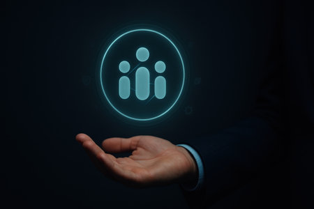Businessman hand showing social network icon on dark background. Social media conceptの素材