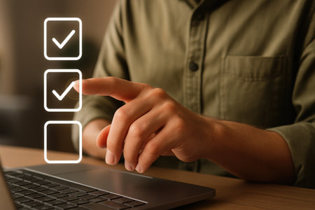 Man pressing checkbox on laptop screen, closeup. Choice conceptの素材
