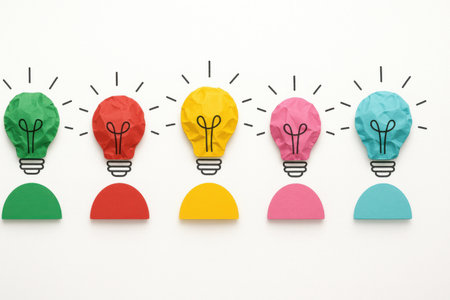 Idea concept with light bulb and colorful paper on white background.の素材