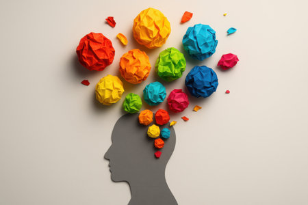 Paper man head with colorful crumpled paper balls on white backgroundの素材