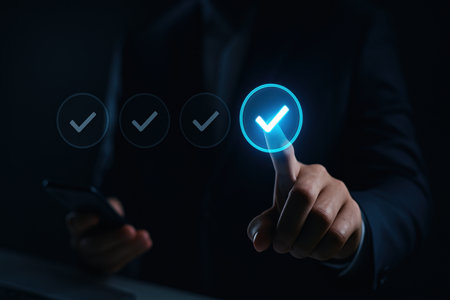 businessman hand using smart phone with check mark icon on virtual screenの素材