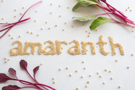 The word amaranth made of grains and vegetables on a white backgroundの素材