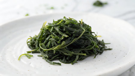 seaweed salad in white plate on white background. Japanese foodの素材