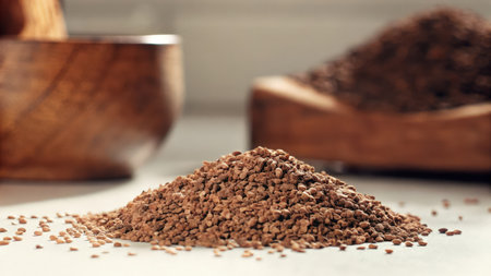 Pile of instant coffee powder in wooden bowl on table, closeupの素材