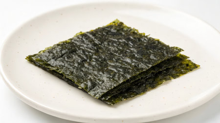 Dried seaweed on white plate isolated on white background. Japanese foodの素材