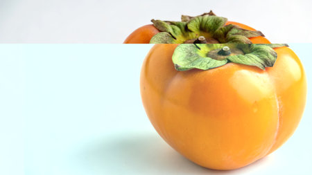 Persimmon fruit isolated on white background. (Selective focus)の素材