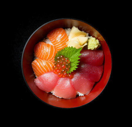 Sushi in a bowl on a black background. Top view.の素材