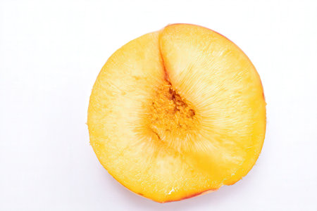 peach slice isolated on white background, close up, top viewの素材