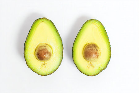 Avocado isolated on white background. Top view. Flat lay.の素材