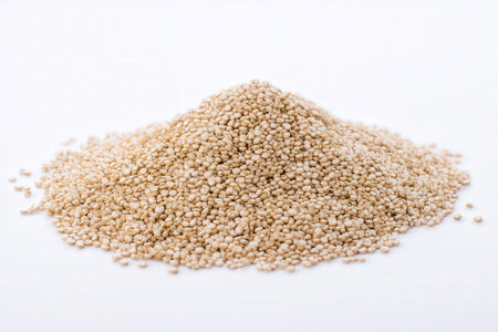 Heap of white quinoa seeds isolated on a white background.の素材