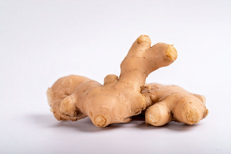 Ginger root isolated on white background. Healthy food concept. Studio shot.の素材