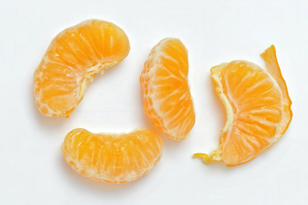 Peeled tangerines on a white background. Close-up.の素材