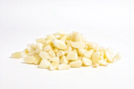 Garlic cloves on a white background close-up, selective focusの素材