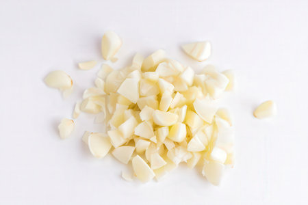Peeled garlic on a white background. Flat lay, top view.の素材