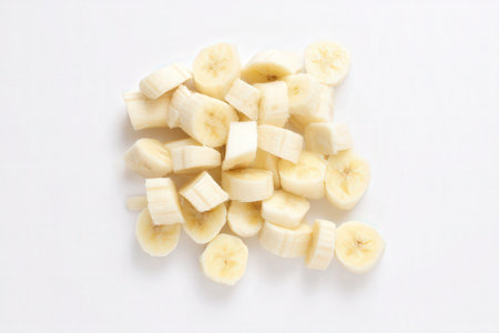 Banana slices isolated on white background. Top view. Flat lay.の素材