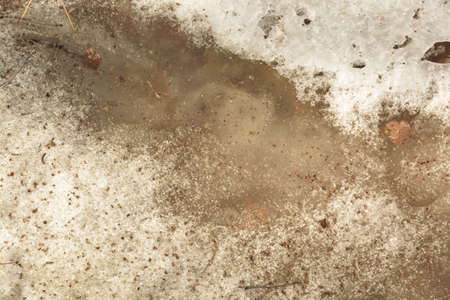 Tiny Puddle in the Melting Snow. Photo made in Russian Sibiria.の写真素材