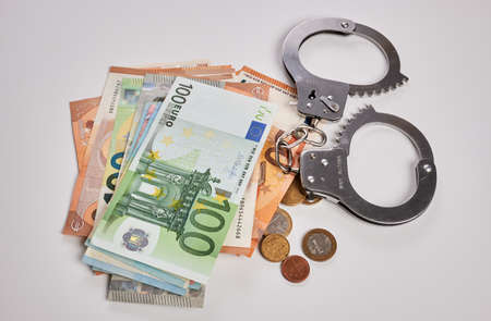 Photo of a Euro money handcuffs.の写真素材