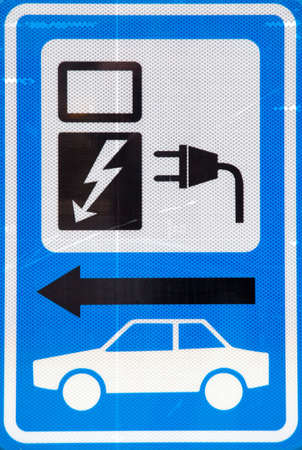 blue and white sign for loading electric carの写真素材