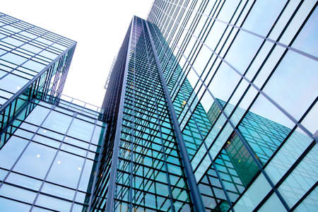 modern building made of glass and steel with reflectionsの写真素材