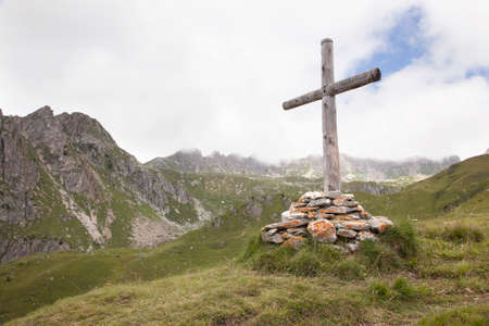 wooden cross in mountains of the french region haute savoieの写真素材