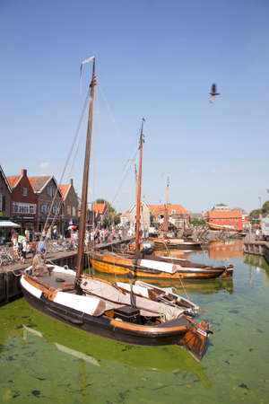 old dutch sailing vessels in the harbor of Spakenburg in the Netherlandsのeditorial素材