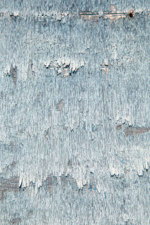 abstract background consisting of weathered board with old blue paintの写真素材