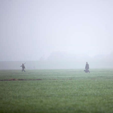 hunting party in meadow in holland under misty conditionsの写真素材