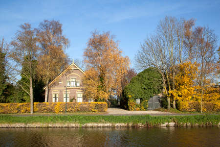 old farm between De Meern and Harmelen in The Netherlands and autumn colorsの写真素材