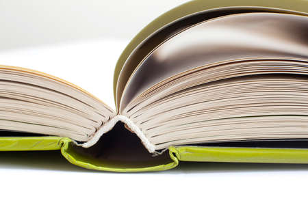 closeup of open book with green coverの写真素材
