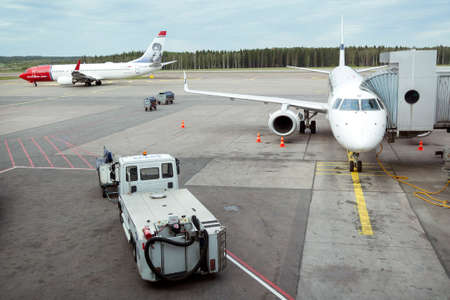 airplanes on helsinki vantaa airport landing and waiting for passengersのeditorial素材