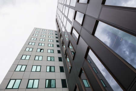 modern facades of university office buildings and reflections of clouds in windowsのeditorial素材