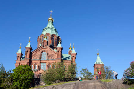 tourists take photographs near uspenski cathedral in helsinki in springのeditorial素材