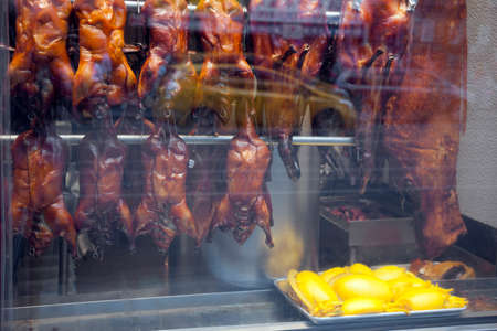 prepared animals for food in shopping window of chinese restaurant in chinatown manhattan new york cityの写真素材