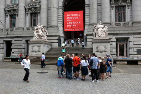 people stand in front of national museum of the american indian in downtown manhattan new york city near bowling greenのeditorial素材