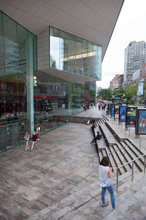 new york, 12 september 2015: people walk in front of Juilliard school on Lincoln Center Plaza, New...