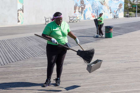 new york city, 15 september 2015: african american women work on coney island to keep the streets cleanのeditorial素材