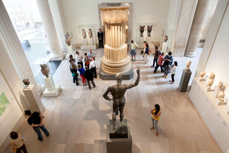 visitors look at sculpture in the new york metropolitan museum of artのeditorial素材
