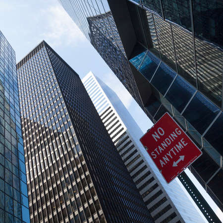 modern glass and steel office buildings in lower manhattan and no standing signの写真素材