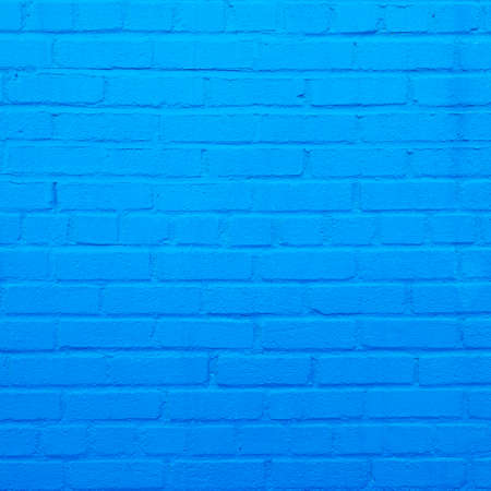 square part of bright sky blue painted brick wallの写真素材