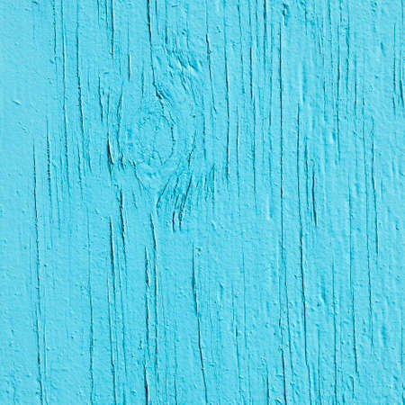 square part of old  wood with fading cracked turqoise paintの写真素材