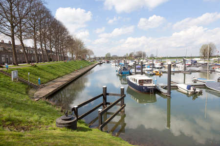 marina of dutch town culemborg near river lek or rhine in the netherlandsの写真素材
