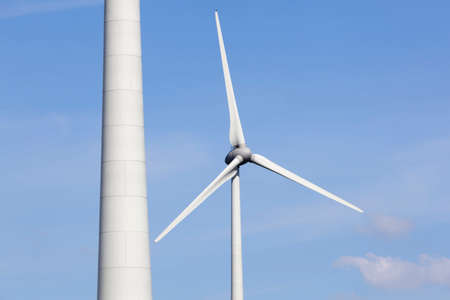 wind turbines in the dutch province of flevoland with blue sky in sunny wheather.