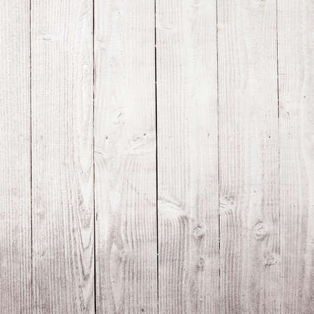 vertical planks of faded white painted worn planks on square piece of fence or doorの写真素材