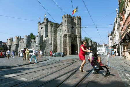 castle Gravensteen and city life on sunny summer day in Flemisch town of Ghent in Belgiumのeditorial素材