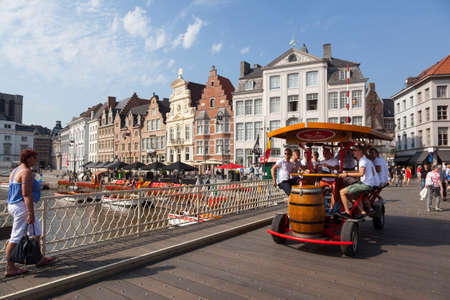 beer bike on grasbrug in centre of medieval Ghent in Belgium on sunny summer dayのeditorial素材