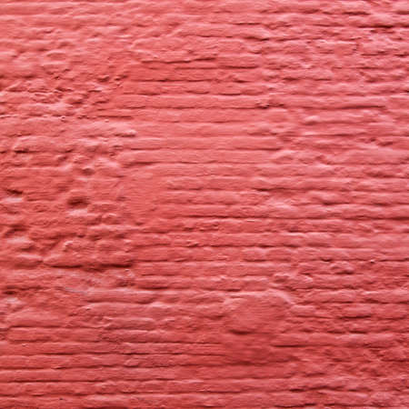 square part of red painted old brick wallの写真素材
