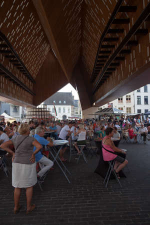 people enjoy drinks and atmosphere in stadshal of Ghent in belgiumのeditorial素材