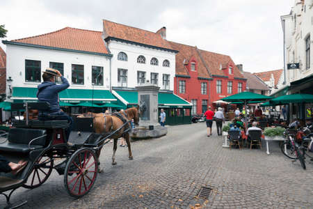 horse carriage in old part of belgian city brugge near begijnhofのeditorial素材