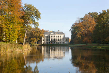 colorful trees and pond in the park of manor broekhuizen near leersum in the province of utrecht in the netherlands during fallの写真素材
