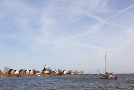 old wooden sailing boat on IJmeer near Durgerdam and amsterdam in hollandの写真素材